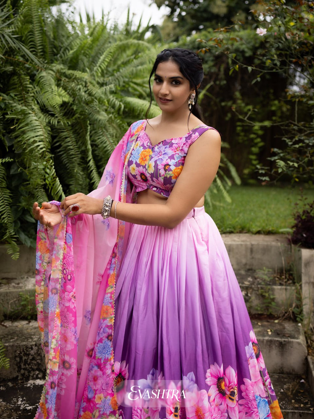 Close-up of Blossom Cascade lehenga skirt highlighting vibrant floral and geometric print in pink and purple tones."