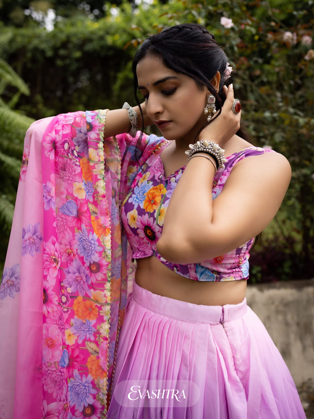 Detailed shot of Blossom Cascade orchid pink printed lehenga blouse and skirt, with floral and geometric pattern accents.